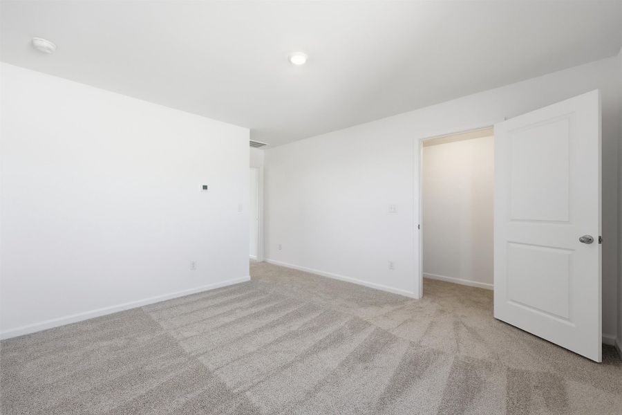 Unfurnished room featuring light carpet Unfurnished room featuring light carpet