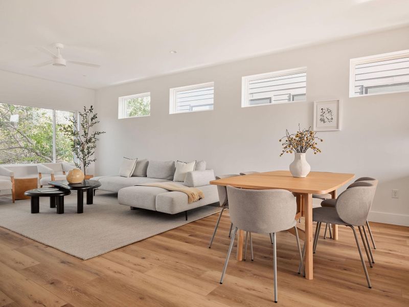 Dining space with light wood-type flooring and a ceiling fan