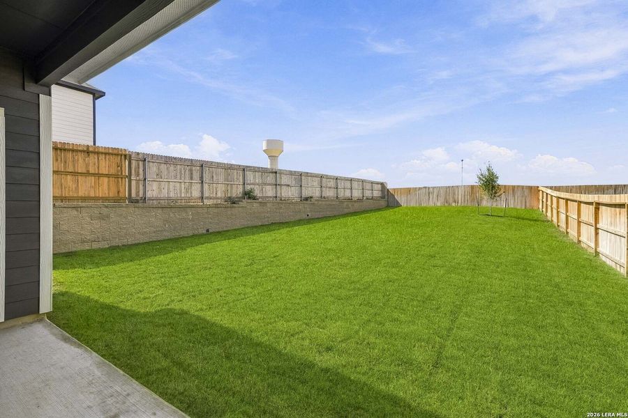 Exterior details and patio area of a home in Hickory Ridge, Elmendorf (Image 3).