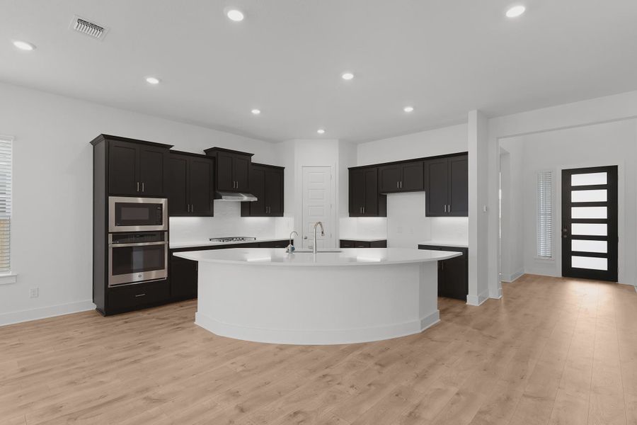 Representative furnished interior of a home built from the Madison by Chesmar Homes in Newhaven, Manor (Image 4).