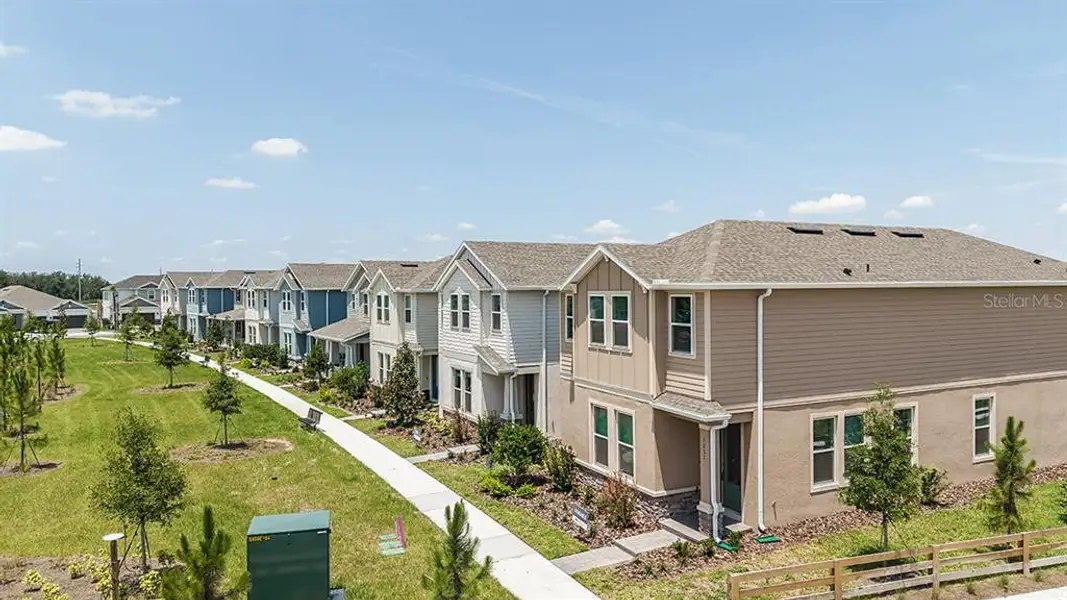 Front exterior of a new home in The Waters at Center Lake Ranch, St. Cloud, FL, highlighting curb appeal (Image 1).