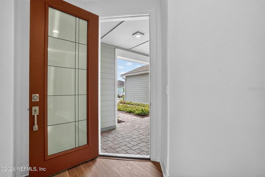 Exterior details and patio area of a home in Del Webb Wildlight, Wildlight (Image 23).