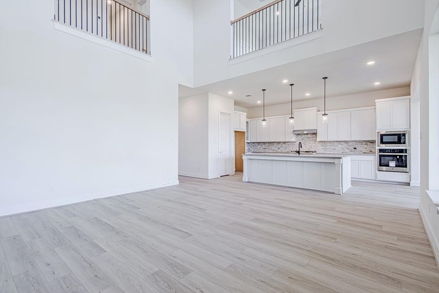 Open staircase detail adds architectural character to the main living space