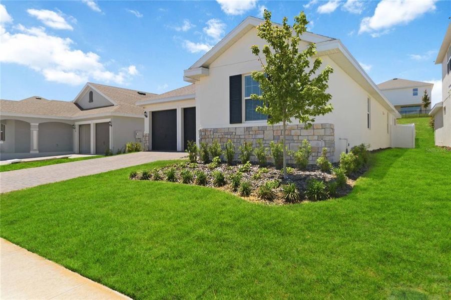 Front exterior of a new home in , Clermont, FL, highlighting curb appeal (Image 23).