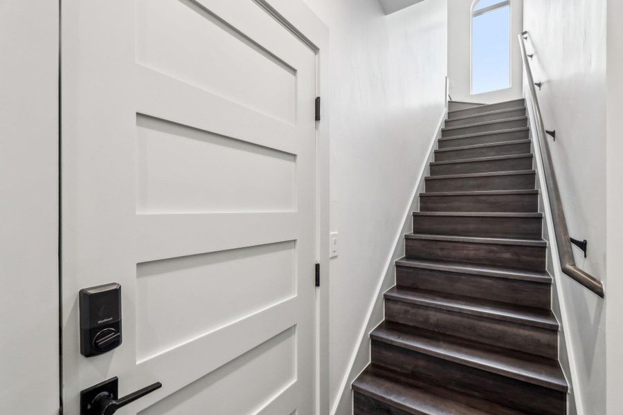 View of staircase leading to primary suite View of staircase leading to primary suite