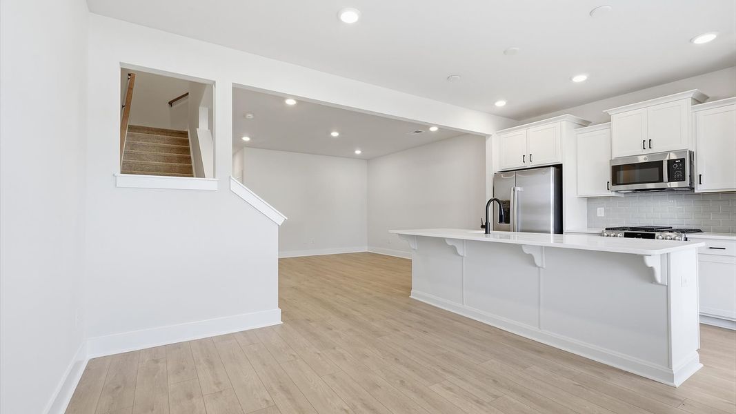 Light-filled breakfast area offering a comfortable space to gather and unwind by DRB Homes Light-filled breakfast area offering a comfortable space to gather and unwind by DRB Homes
