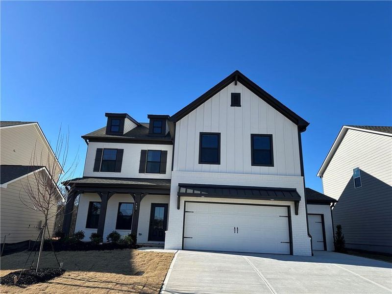 Front exterior of a new home in Summerlin, Winder, GA, highlighting curb appeal (Image 22).