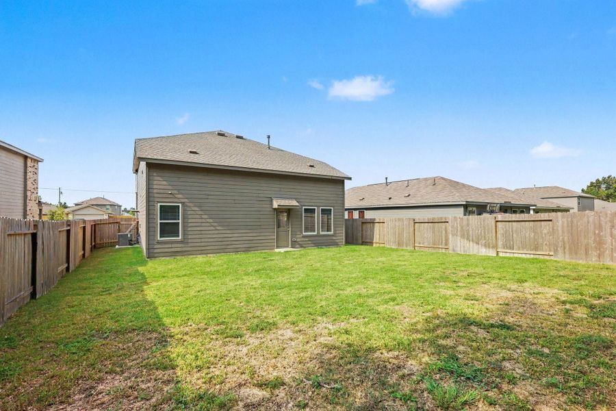 Exterior details and patio area of a home in Hill and Dale Ranch, Splendora (Image 14).