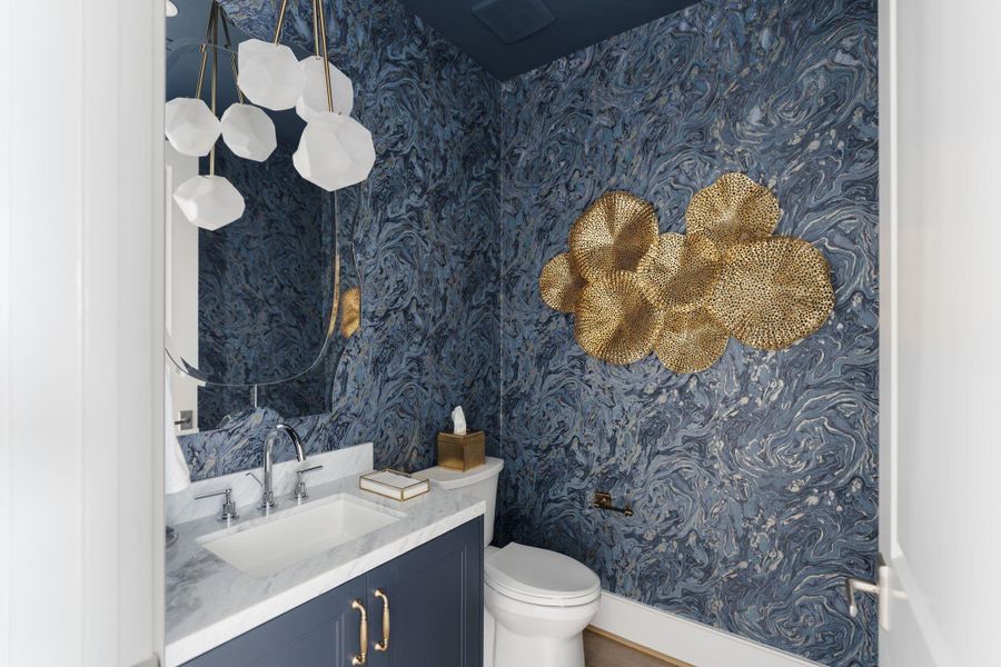 Proof that luxury is in the particulars. In a home this expansive, even the powder room is a curated jewel box of blue-toned cabinetry and precision lighting. Proof that luxury is in the particulars. In a home this expansive, even the powder room is a curated jewel box of blue-toned cabinetry and precision lighting.