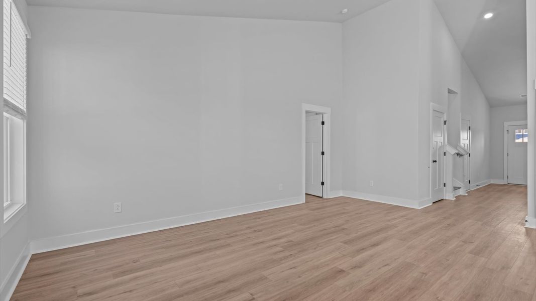 First-class living space featuring expansive ceilings, elegant design, and open sightlines to the kitchen