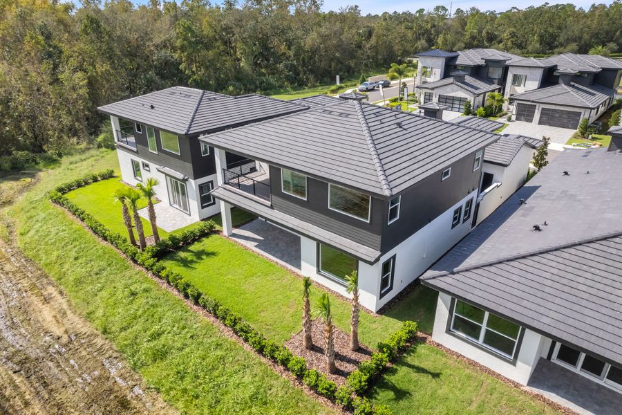 Exterior details and patio area of a home in Hampton Green at Providence, Davenport (Image 4). Exterior details and patio area of a home in Hampton Green at Providence, Davenport (Image 4).