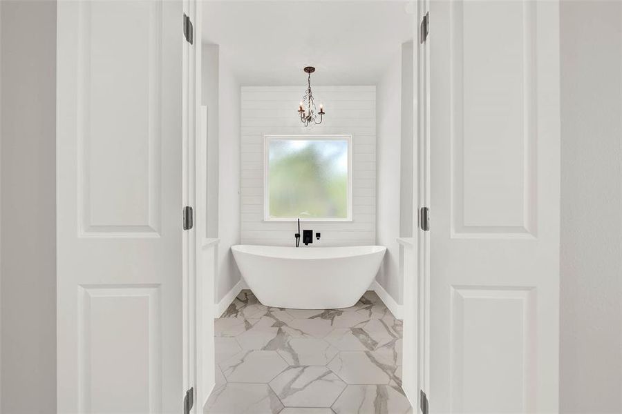 Oversized soaking tub with shiplap