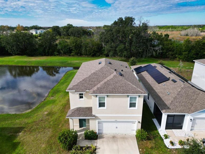 Front exterior of a new home in Cascades, Davenport, FL, highlighting curb appeal (Image 17). Front exterior of a new home in Cascades, Davenport, FL, highlighting curb appeal (Image 17).