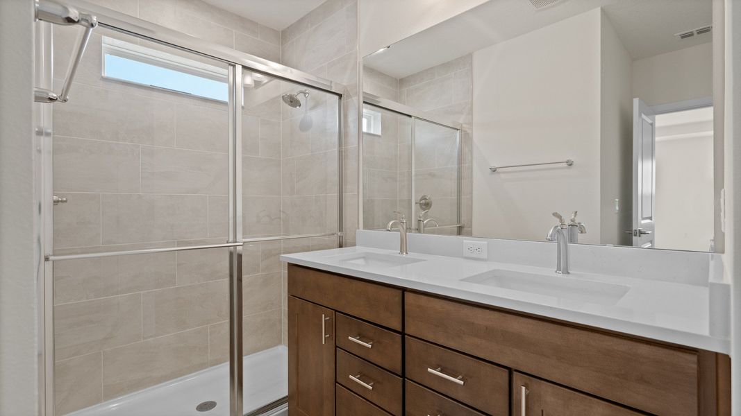 The Atwood Primary en suite bath by DRB Homes in Hamilton Bluff, Haines City, FL The Atwood Primary en suite bath by DRB Homes in Hamilton Bluff, Haines City, FL