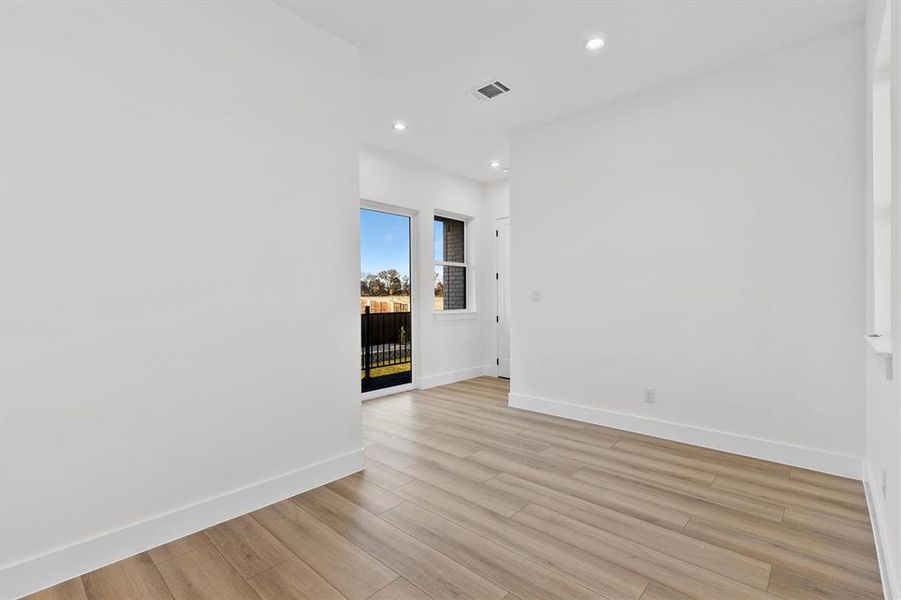 Oh the possibilities! This upstairs flex space can be used for so many different things....hanging out, crafting, studying, gameroom! Check out the balcony overlooking the large backyard!