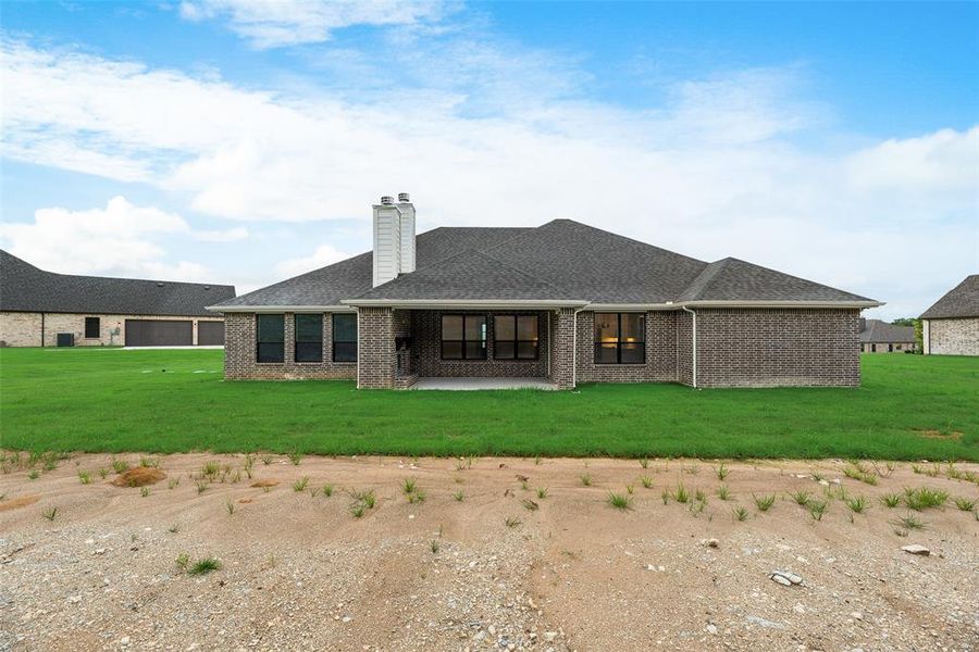 Front exterior of a new home in King Crossing Estates, Van Alstyne, TX, highlighting curb appeal (Image 19). Front exterior of a new home in King Crossing Estates, Van Alstyne, TX, highlighting curb appeal (Image 19).