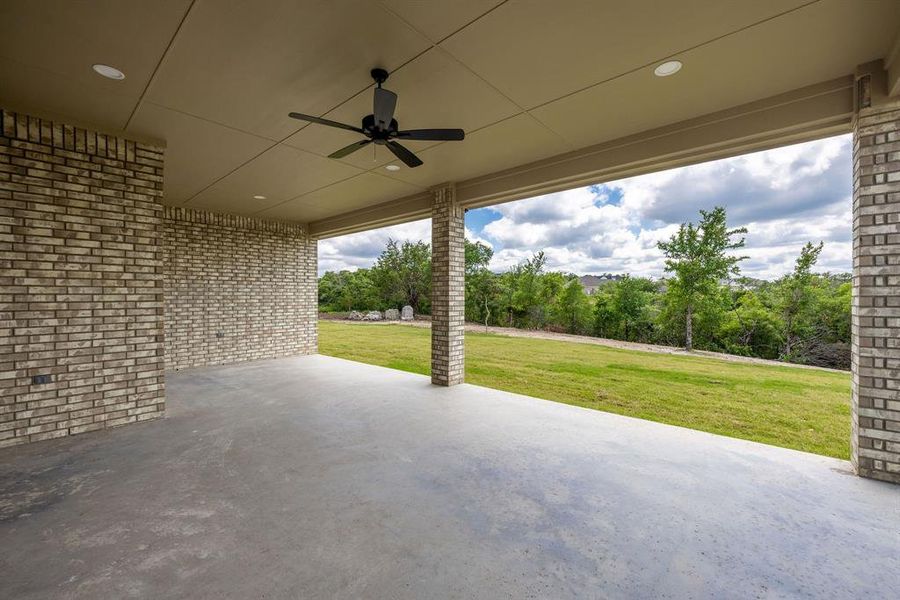 Covered patio featuring concrete flooring, recessed lighting, and a ceiling fan