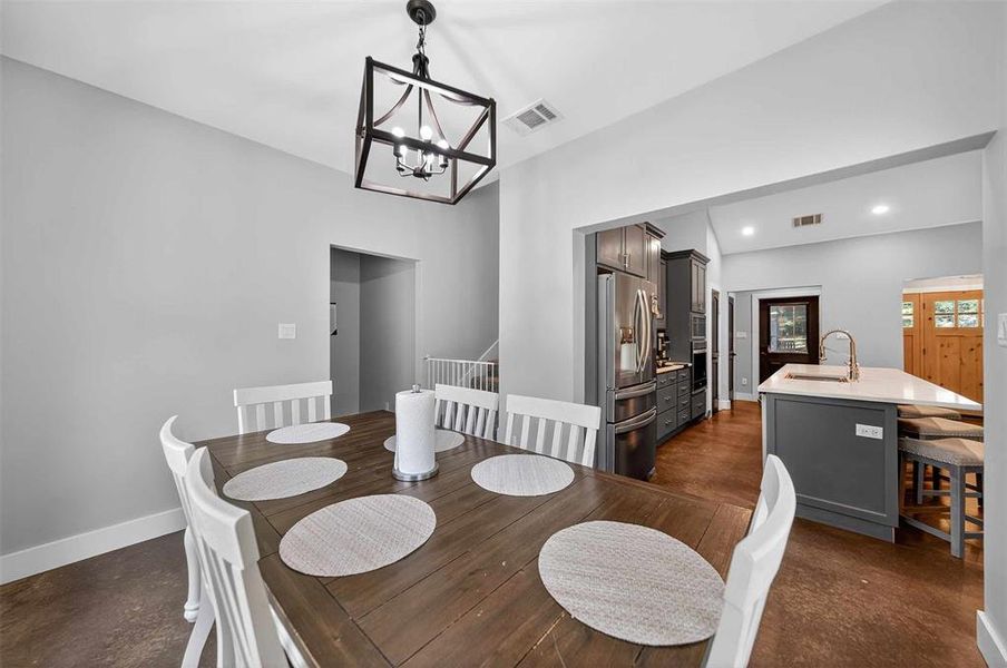 Dining area featuring a chandelier and recessed lighting Dining area featuring a chandelier and recessed lighting