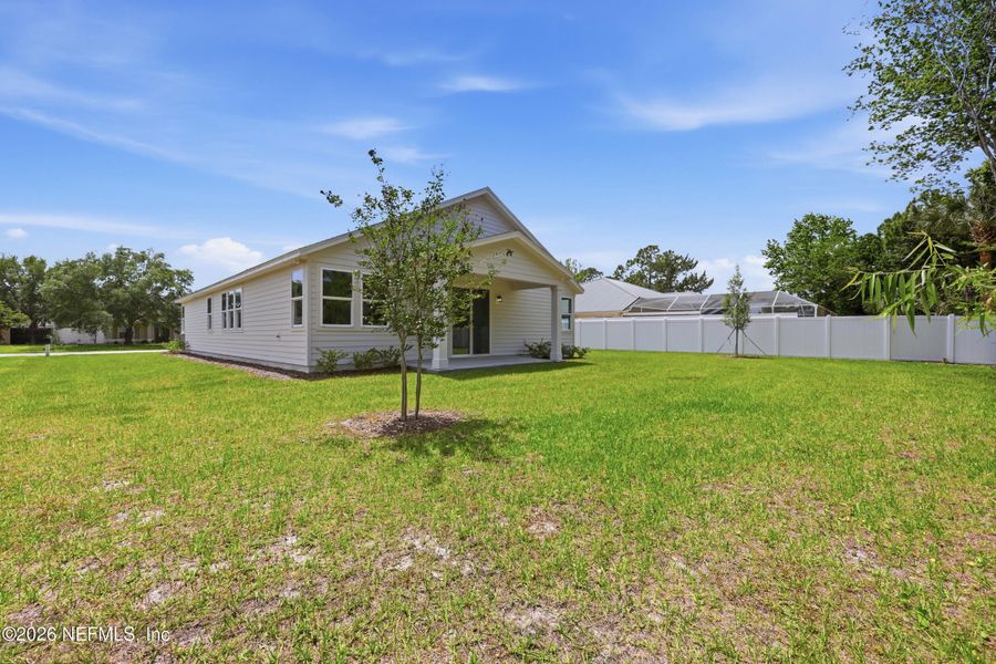Exterior details and patio area of a home in Palm Coast Homes, Palm Coast (Image 3).