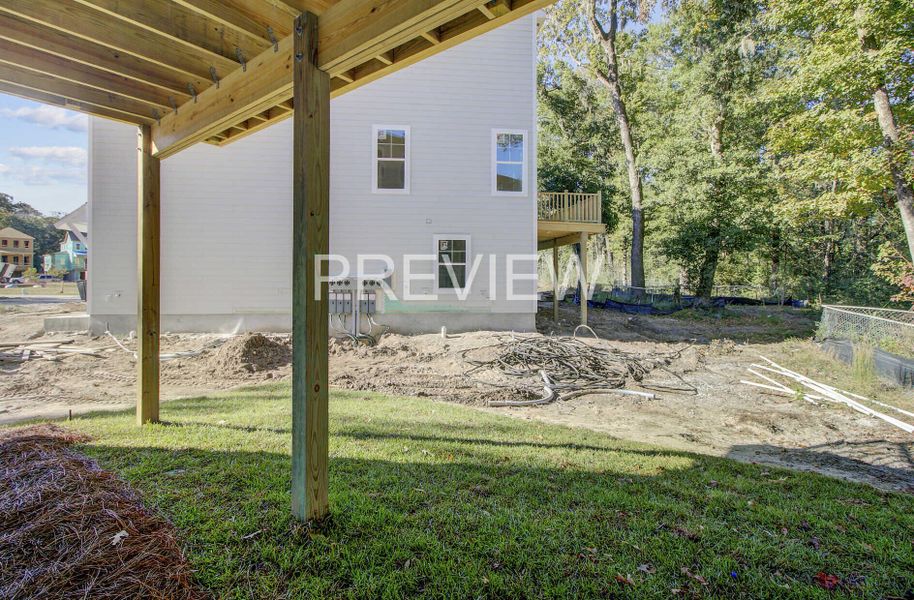 Exterior details and patio area of a home in , Johns Island (Image 21).