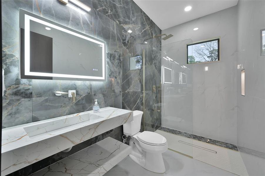 Conveniently located next to Bedroom 2, this elegant bathroom offers style and functionality.