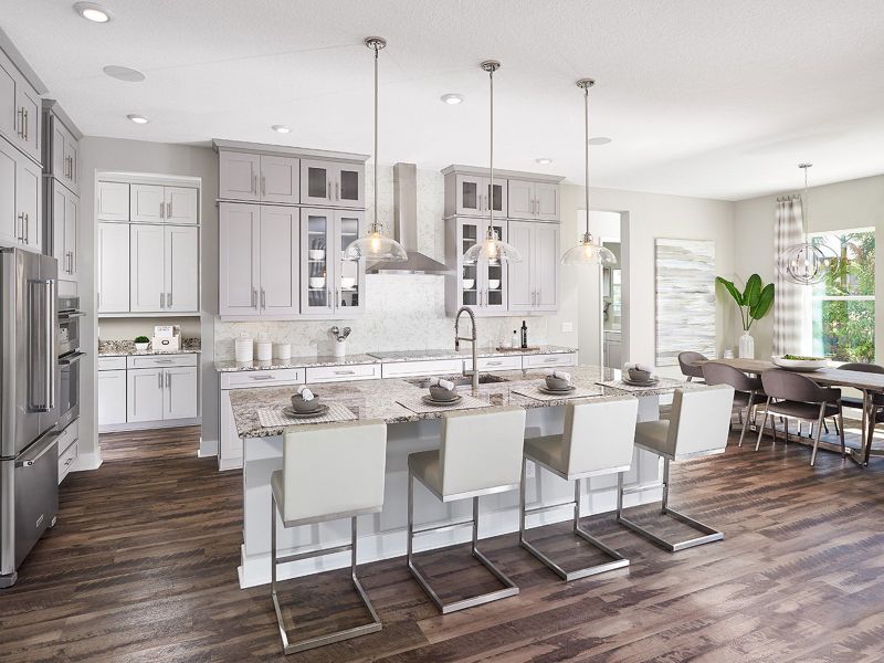 This beautifully designed gourmet kitchen is a chef's dream with built-in stainless steel appliances and tons of counter space.