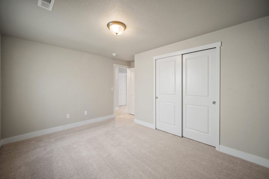 Spacious, unfurnished interior of a new home in The Glen, Colorado Springs (Image 35).