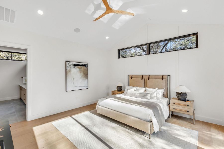 Bedroom with recessed lighting, light wood-style floors, connected bathroom, and ceiling fan