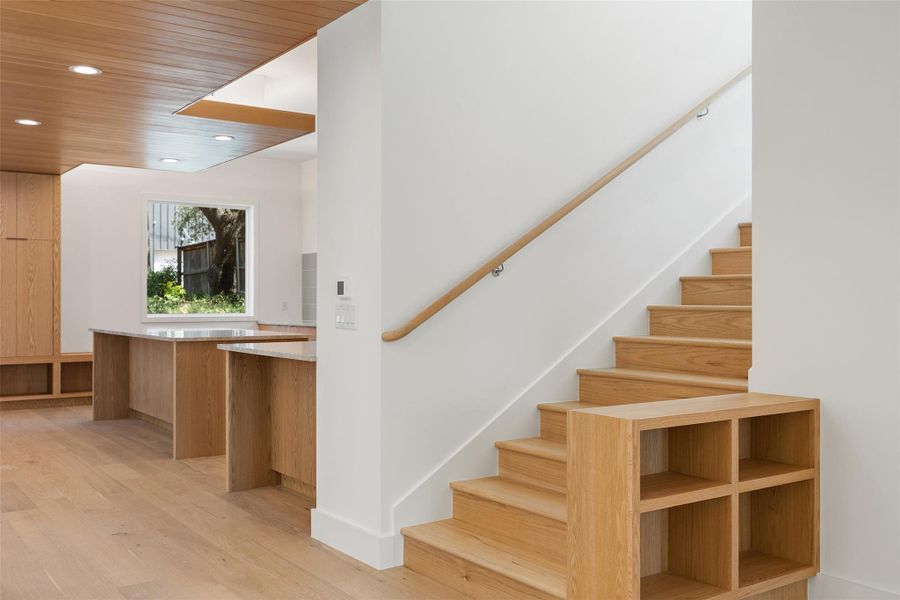 Staircase with recessed lighting, wood finished floors, and wood ceiling Staircase with recessed lighting, wood finished floors, and wood ceiling
