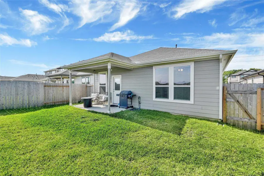 Step outside to a private, fully fenced backyard—a peaceful retreat with plenty of room for outdoor dining, gardening, or family playtime under the Texas sky.