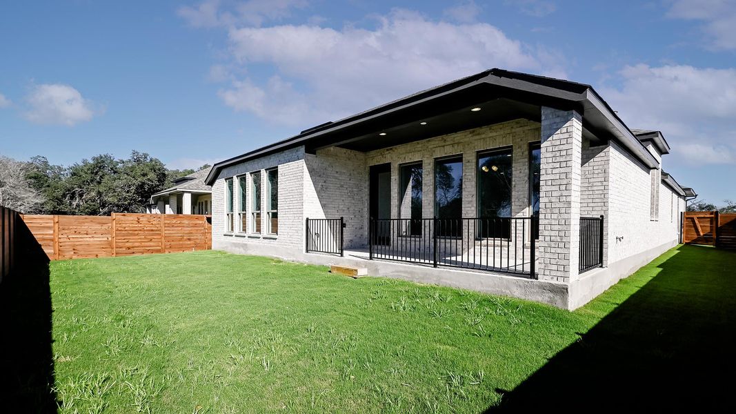 Exterior details and patio area of a home in Juniper Springs, Lockhart (Image 3).