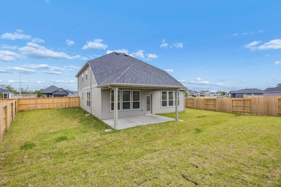 Exterior details and patio area of a home in Windcress, Cove (Image 3).