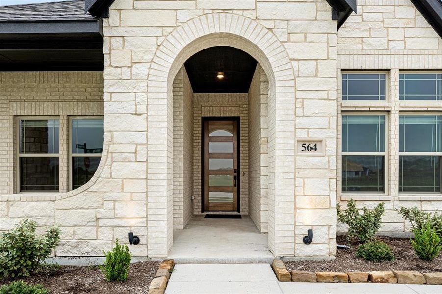 Front exterior of a new home in The Retreat at North Grove 60, Waxahachie, TX, highlighting curb appeal (Image 1). Front exterior of a new home in The Retreat at North Grove 60, Waxahachie, TX, highlighting curb appeal (Image 1).