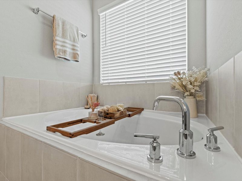 Spa-like soaking tub in the primary bathroom.