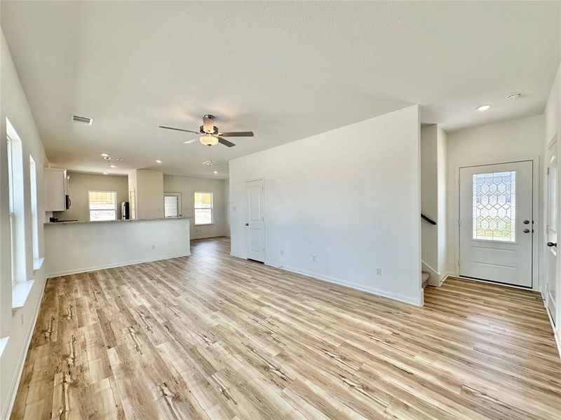 Luxury vinyl plank flooring throughout Family, Dining and Kitchen.