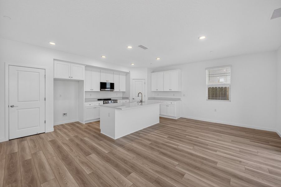 A kitchen with white cabinets. A kitchen with white cabinets.