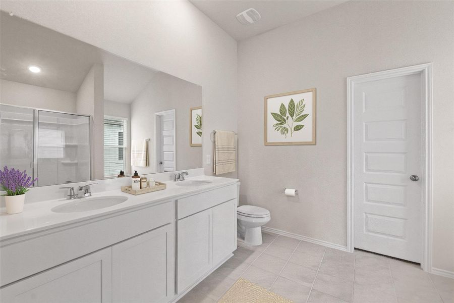 The primary bathroom features a dual vanity with plenty of counter space, making morning routines smooth and easy *Virtually staged image The primary bathroom features a dual vanity with plenty of counter space, making morning routines smooth and easy *Virtually staged image