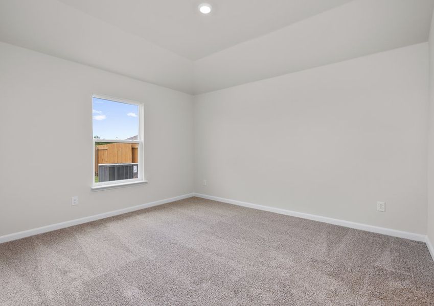 The master bedroom is spacious and has a large window. The master bedroom is spacious and has a large window.