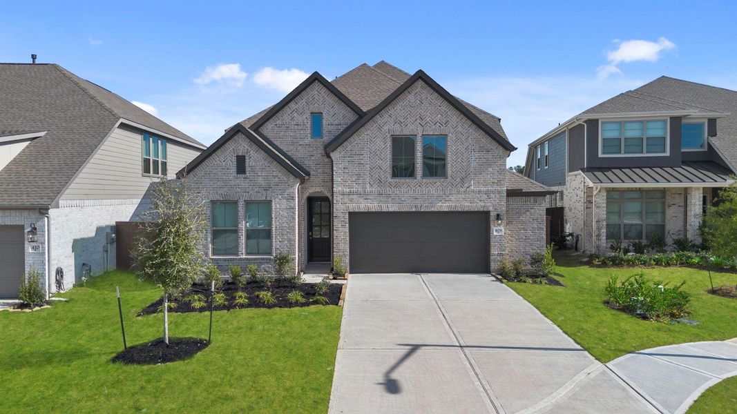 Front exterior of a new home in The Trails 50', New Caney, TX, highlighting curb appeal (Image 21).