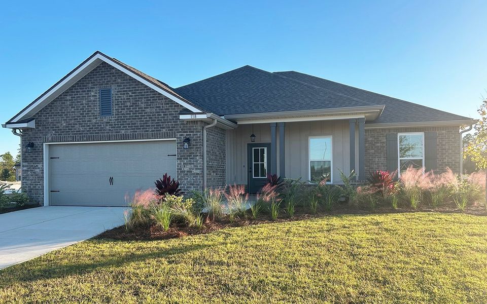 Front exterior of a new home in Natureview, Freeport, FL, highlighting curb appeal (Image 1).
