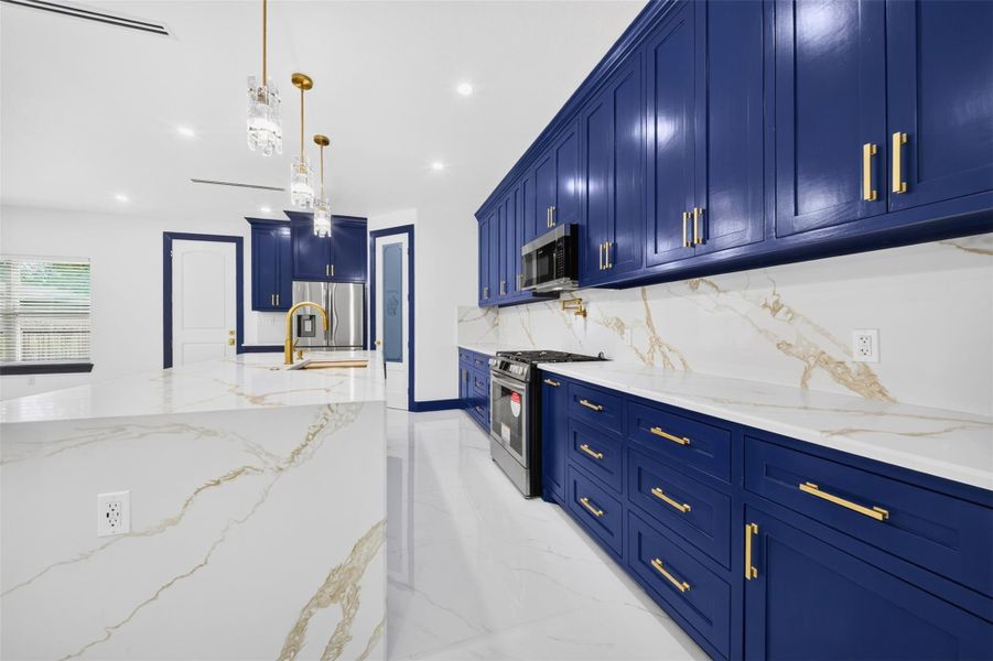 Additional kitchen perspective showcasing abundant cabinetry and modern finishes