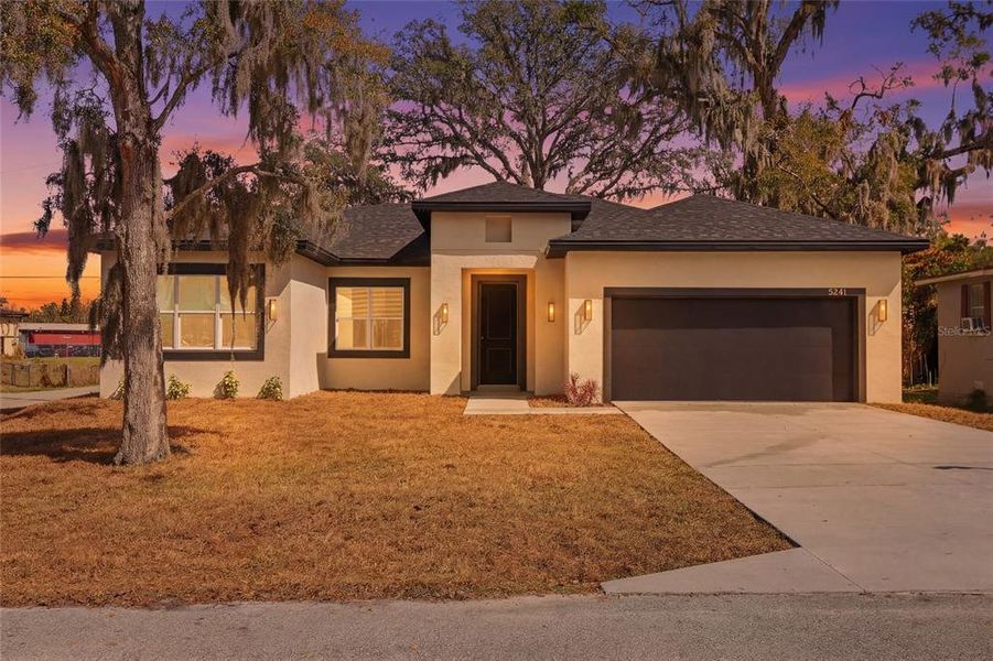 Front exterior of a new home in , Orlando, FL, highlighting curb appeal (Image 23).