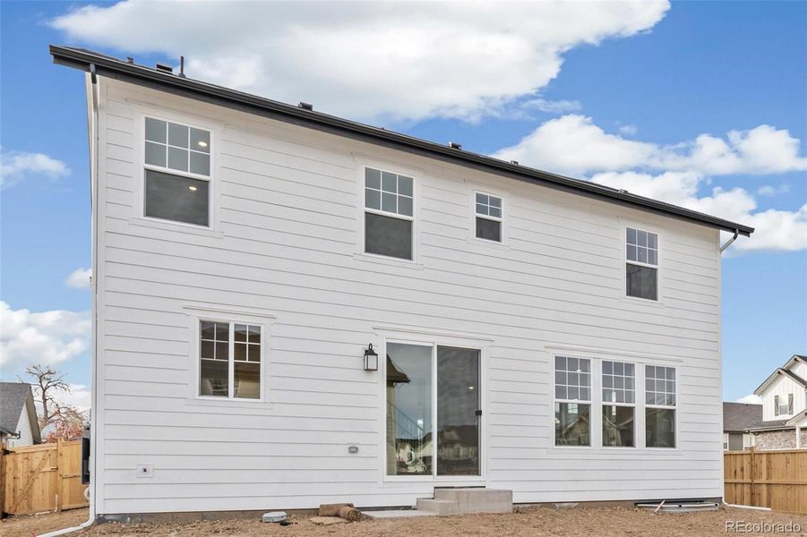 Exterior details and patio area of a home in Windsong, Thornton (Image 3).