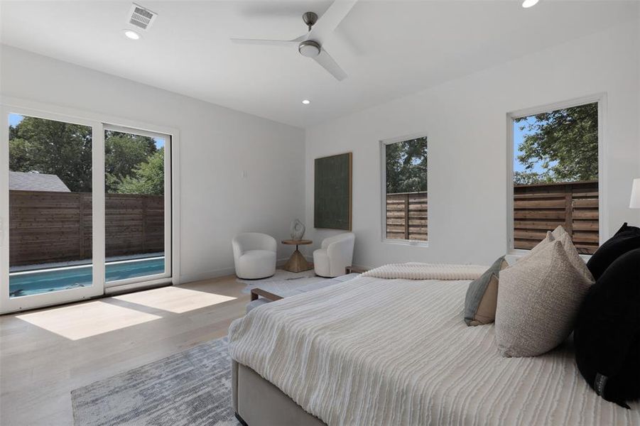 Bedroom featuring access to exterior, recessed lighting, wood finished floors, and a ceiling fan