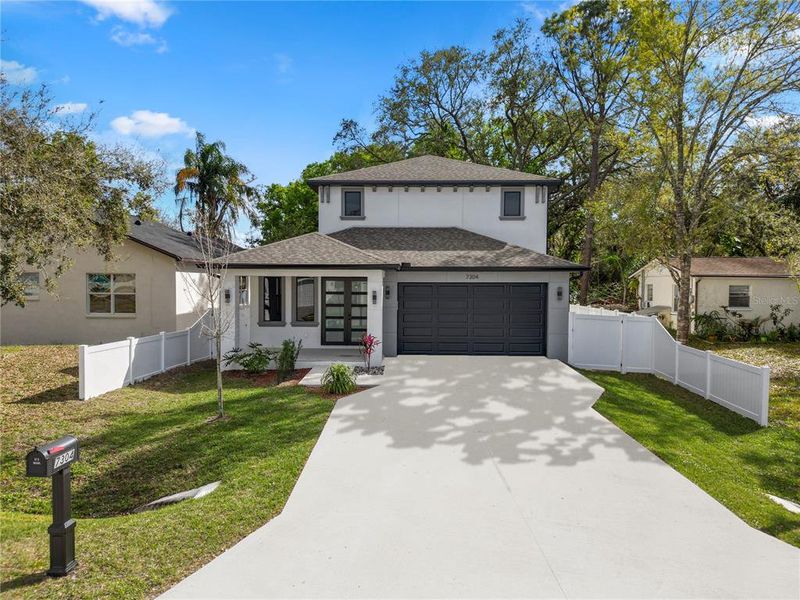 Front exterior of a new home in , Tampa, FL, highlighting curb appeal (Image 23).