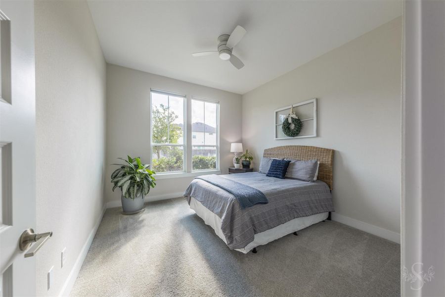 Privately situated downstairs, the spacious secondary bedroom is filled with beautiful natural light and offers an inviting retreat for overnight guests or multigenerational living. Privately situated downstairs, the spacious secondary bedroom is filled with beautiful natural light and offers an inviting retreat for overnight guests or multigenerational living.