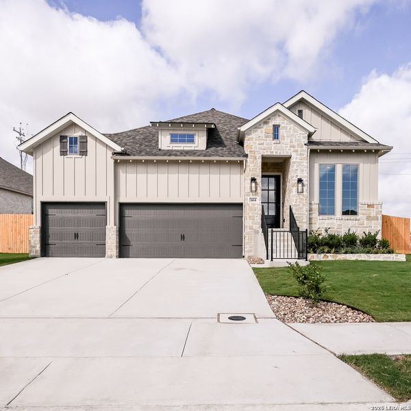 Front exterior of a new home in Cibolo Valley Heights, Cibolo, TX, highlighting curb appeal (Image 2). Front exterior of a new home in Cibolo Valley Heights, Cibolo, TX, highlighting curb appeal (Image 2).