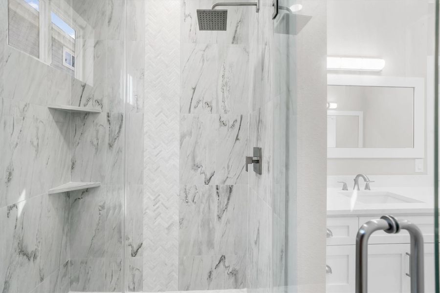 Fully tiled standalone shower with designer shower head and shelving Fully tiled standalone shower with designer shower head and shelving