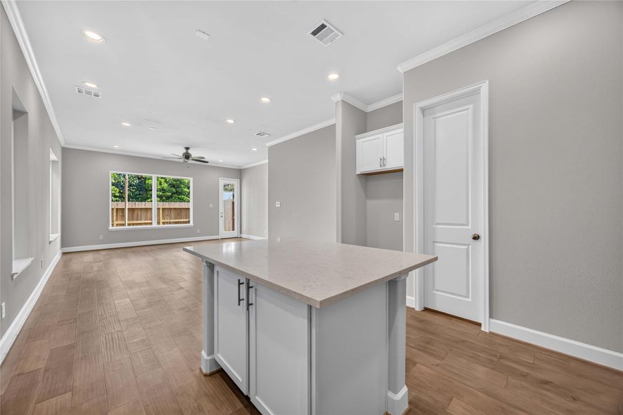 Right Off the Entry – This island kitchen puts prep space and storage exactly where you need it, just steps from the front door.