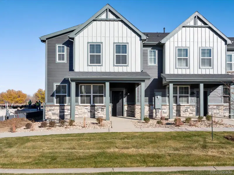 Front exterior of a new home in , Windsor, CO, highlighting curb appeal (Image 2). Front exterior of a new home in , Windsor, CO, highlighting curb appeal (Image 2).